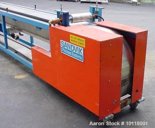 Used Sandvik Belt Cooler (Sandvik Process Systems) 12" x 16' long with polished stainless steel belt. Dual 12" wide x 4.5" diameter jacketed rolls are mounted above cooling belt at beginning and term...
