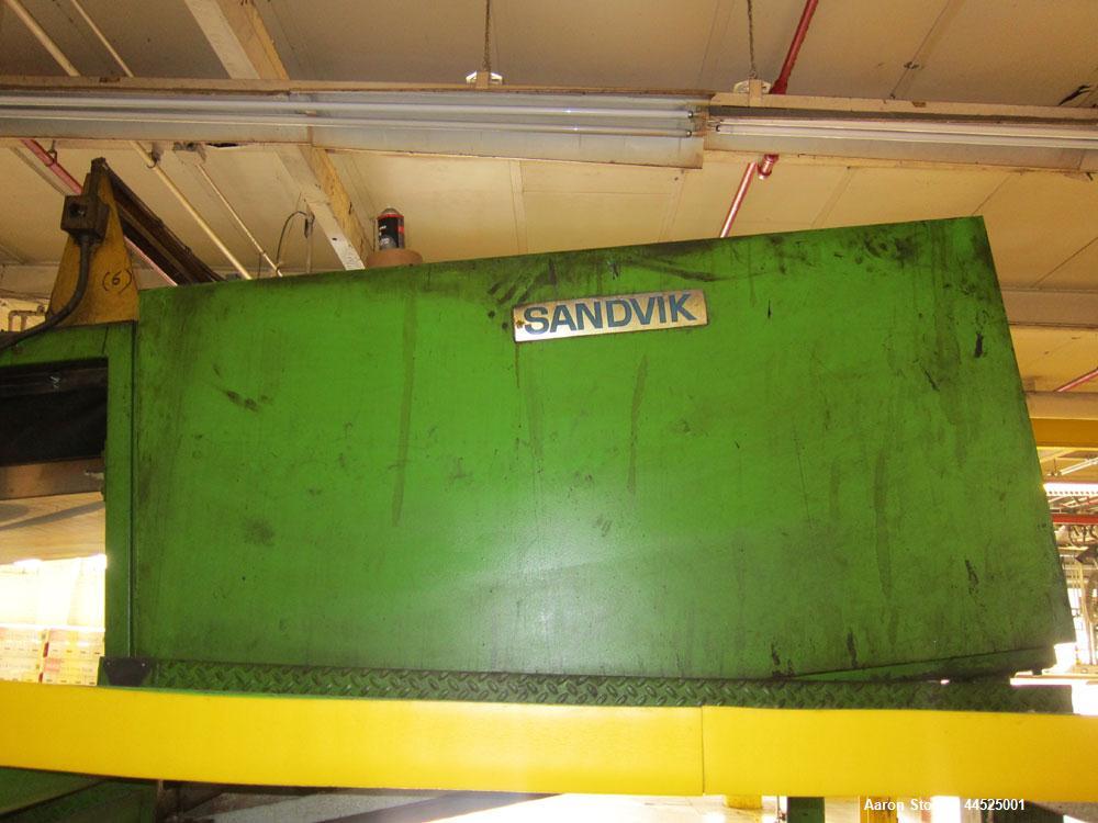 Used Sandvik Model SST stainless steel belt flaker with 55"  wide x 40' long belt.  Last used to cool asphalt used as backing on roofing paper.  Originally installed mid 1980’s, belt was last replace...