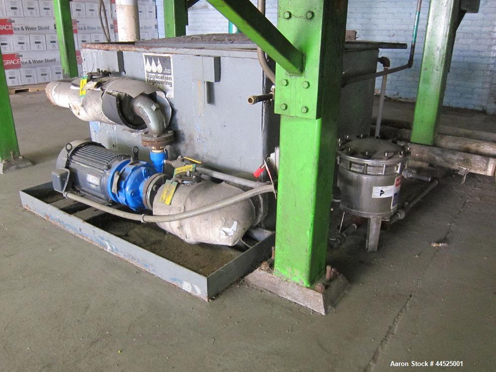 Used Sandvik Model SST stainless steel belt flaker with 55"  wide x 40' long belt.  Last used to cool asphalt used as backing on roofing paper.  Originally installed mid 1980’s, belt was last replace...