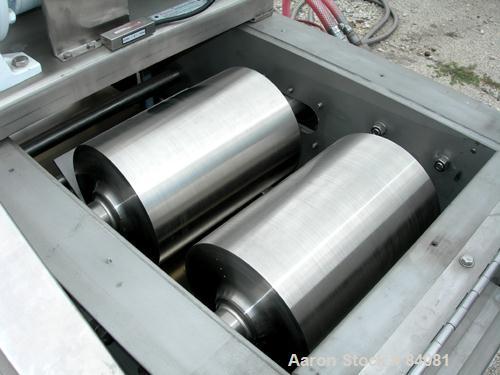Used Sandvik Belt Cooler, 316 Stainless Steel. 12" Wide x 63" long belt, on 24" diameter cored rolls, driven by a 1/2 HP, 3/60/208-230/460 Volt, 1725 RPM gearmotor, ratio 165:1. (2) Pneumatically adj...