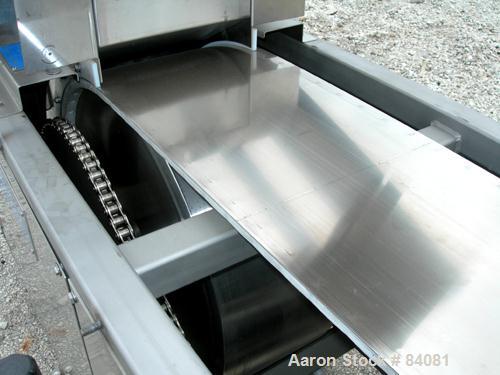 Used Sandvik Belt Cooler, 316 Stainless Steel. 12" Wide x 63" long belt, on 24" diameter cored rolls, driven by a 1/2 HP, 3/60/208-230/460 Volt, 1725 RPM gearmotor, ratio 165:1. (2) Pneumatically adj...