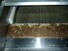 Used Rollomat Hot Melt Production Belt and Rotating Pastillator Applicator Head.  Rated for 500 - 600 kgrs/hour.  Belt is approximately 5' wide x 30' long.  Unit for hot melt glue, resins and rosins....