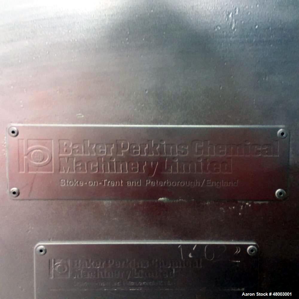 Used Baker Perkins Double Cone Dryer. 3 cubic foot capacity. Stainless steel. Internal rated 20 psig, jacket rated 20 psig at 200 deg C. Hot oil. Mfg. 1981.