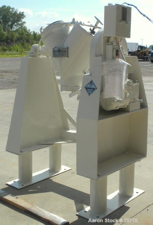 Used Patterson-Kelley 1 Cubic Foot Twin Shell Dry Blender, 304 Stainless Steel. (2) 11" Diameter top charge ports with quick release covers, approximately 16-1/2" deep. Carbon steel jacket rated 30 P...