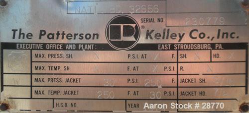 Used Patterson-Kelley 1 Cubic Foot Twin Shell Dry Blender, 304 Stainless Steel. (2) 11" Diameter top charge ports with quick release covers, approximately 16-1/2" deep. Carbon steel jacket rated 30 P...