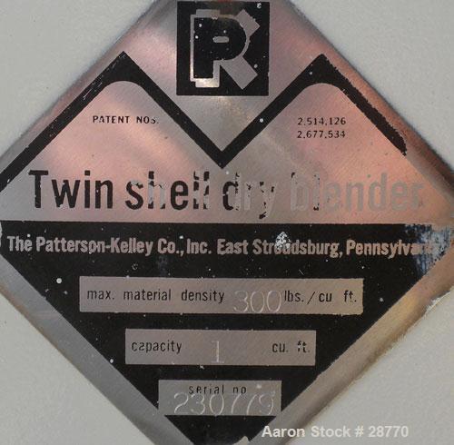Used Patterson-Kelley 1 Cubic Foot Twin Shell Dry Blender, 304 Stainless Steel. (2) 11" Diameter top charge ports with quick release covers, approximately 16-1/2" deep. Carbon steel jacket rated 30 P...
