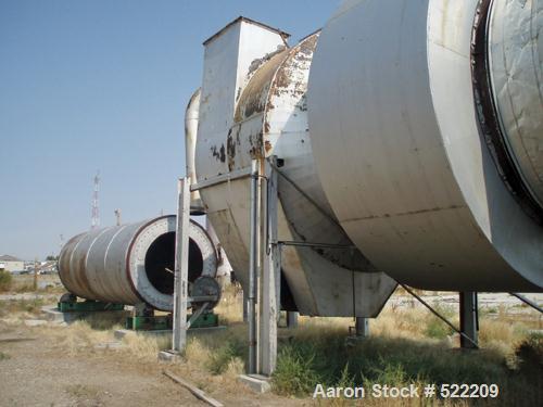 USED: Stern Roger rotary drum dryer system consisting of a Stern Roger10'6" diameter x 60' long single pass rotary drum dryer with a newPeabody 30,000,000 btu burner. Also included is a Heil dryer us...