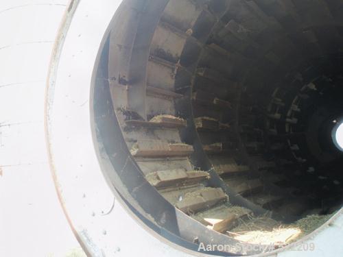 USED: Stern Roger rotary drum dryer system consisting of a Stern Roger10'6" diameter x 60' long single pass rotary drum dryer with a newPeabody 30,000,000 btu burner. Also included is a Heil dryer us...