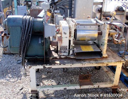 Used Stokes Double Drum Dryer, Model 214-0A. (2) 8-1/2" diameter x 11" face width cored drums with rotary unions, rated 100 psi. Knife discharge, dual edge guides. Driven by a 1.5 hp, 230/460 volt Re...