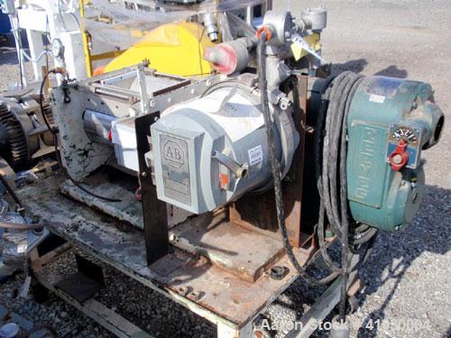 Used Stokes Double Drum Dryer, Model 214-0A. (2) 8-1/2" diameter x 11" face width cored drums with rotary unions, rated 100 psi. Knife discharge, dual edge guides. Driven by a 1.5 hp, 230/460 volt Re...