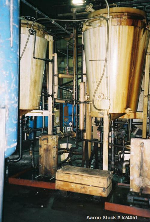 USED: Flash drying system designed to remove 1% to 2% water from industrial lubricating oils. Oil is pumped through a plate type heat exchanger where it enters the flash dryer chambers through a spra...
