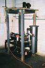 USED: Flash drying system designed to remove 1% to 2% water from industrial lubricating oils. Oil is pumped through a plate type heat exchanger where it enters the flash dryer chambers through a spra...