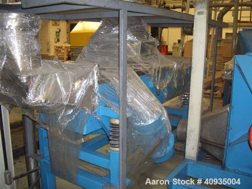 Used Fluid bed dryer. Stainless steel construction. 3 deck seperation. Approximately 30" x 7' long. Unit includes heating element and blower assembly.