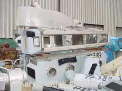 USED: Schugi continuous insulated fluid bed dryer. 16" wide x 10' long. Stainless steel-galvanized aluminum exterior. Includes top plenum, steam chest, some interconnecting pipe, 1 vibratory pan disc...