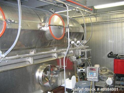 Used Carrier Vibratory Fluid Bed Dryer. 16' x 28" fluidized bed, stainless steel construction, CIP spray ports with external headers, pneumatic discharge weir, 304 stainless steel supports, welded st...