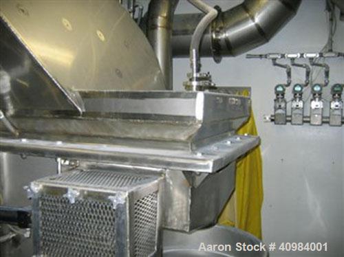 Used Carrier Vibratory Fluid Bed Dryer. 16' x 28" fluidized bed, stainless steel construction, CIP spray ports with external headers, pneumatic discharge weir, 304 stainless steel supports, welded st...