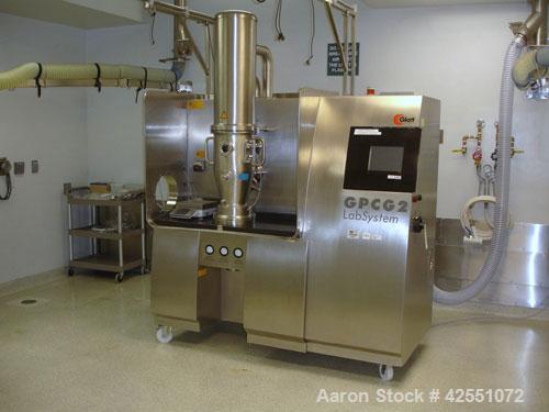 Used Glatt Fluid Bed Dryer, Model GPCG 2, Stainless Steel. 6.5 Bar internal shock rating, (2) spray granulation inserts, (1) Wurster insert, integrally mounted control panel with humidificatin cabine...
