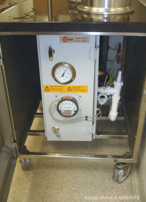 Used Glatt Fluid Bed Dryer, Model GPCG 2, Stainless Steel. 6.5 Bar internal shock rating, (2) spray granulation inserts, (1) Wurster insert, integrally mounted control panel with humidificatin cabine...