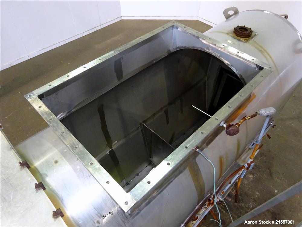 Used Scott Fluid Bed Dryer, Stainless Steel. Approximate 32" wide x 13' long, approximately 32 square feet of drying area. Includes cover.