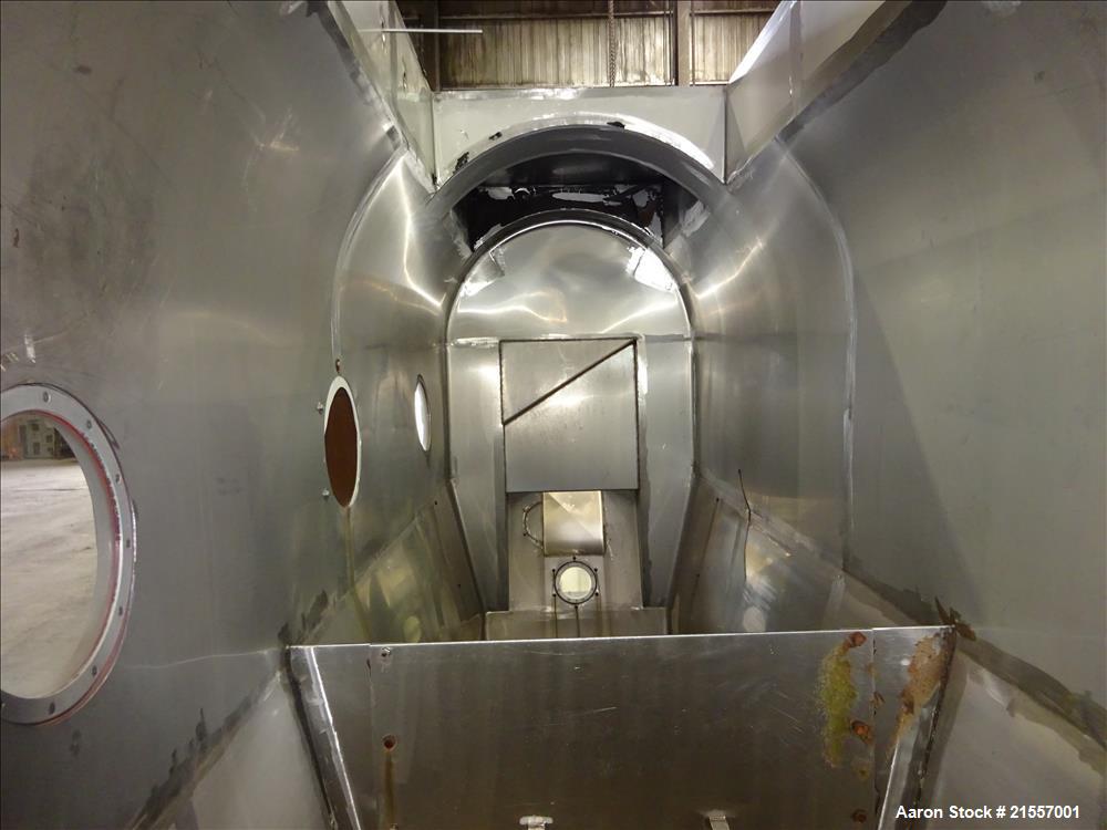 Used Scott Fluid Bed Dryer, Stainless Steel. Approximate 32" wide x 13' long, approximately 32 square feet of drying area. Includes cover.