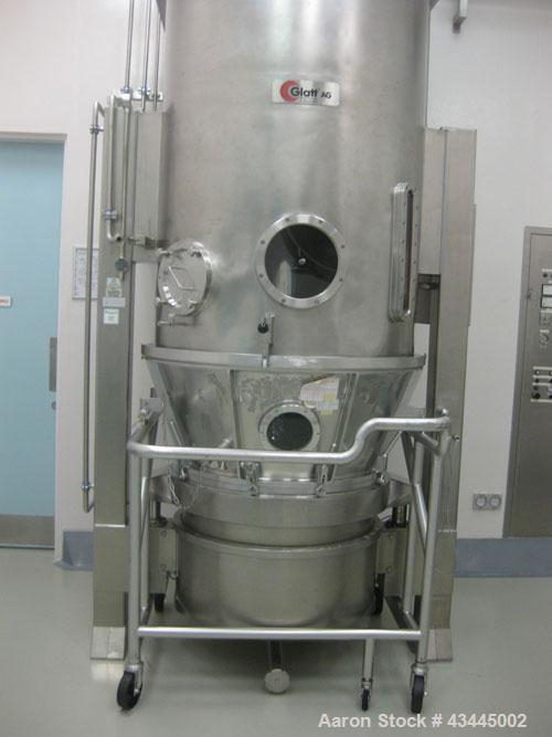 Used GLATT MODEL WSG120 STAINLESS STEEL FLUID BED DRYER. UNIT INCLUDES (3) STAINLESS STEEL MOBILE PRODUCT CONTAINERS, (1) FAN RATED 6000CUMT/HOUR. (1) HYDRAULIC POWERPACK. INCLUDES SWITCHGEAR CONTROL...