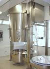 Used Glatt Fluid Bed Dryer, Model GPCG120, Stainless Steel. 2 Bar internal shock rating, spray granulation insert with (3) bowls and (2) bowl carts with top spray gun, Wurster insert with expansion c...