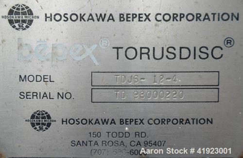 Used Hosokawa Bepex Torus Disc Dryer, Model TDJS-12-4, 316L Stainless Steel. Approximately 5.2 cubic feet working capacity. Approximately 12-1/2'' diameter x 50-1/2'' long x 14" deep trough with an a...
