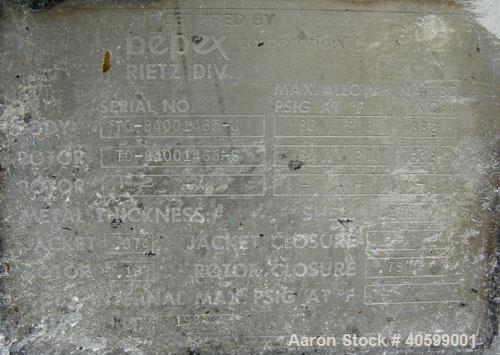 Used Reitz/Bepex Torus Disc Dryer, model TDJS-26-8, 304 stainless steel. Approximately 17 cubic feet working capacity. 24" diameter x 102" long x 4" spaced cored screw, rated 80 psi at 200 deg F, app...