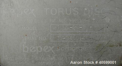 Used Reitz/Bepex Torus Disc Dryer, model TDJS-26-8, 304 stainless steel. Approximately 17 cubic feet working capacity. 24" diameter x 102" long x 4" spaced cored screw, rated 80 psi at 200 deg F, app...
