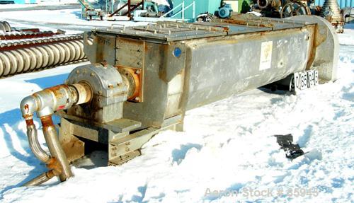 USED: Denver single screw Holo-Flite processor, model S2412-6. 304 stainless steel. (1) 24" diameter x 12' long x 6" pitch cored screw rated 150 psi at 650 deg F. Carbon steel jacketed trough 25" wid...