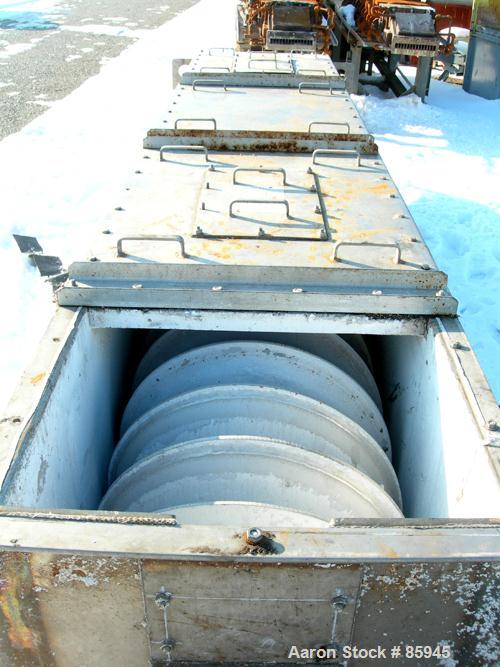 USED: Denver single screw Holo-Flite processor, model S2412-6. 304 stainless steel. (1) 24" diameter x 12' long x 6" pitch cored screw rated 150 psi at 650 deg F. Carbon steel jacketed trough 25" wid...