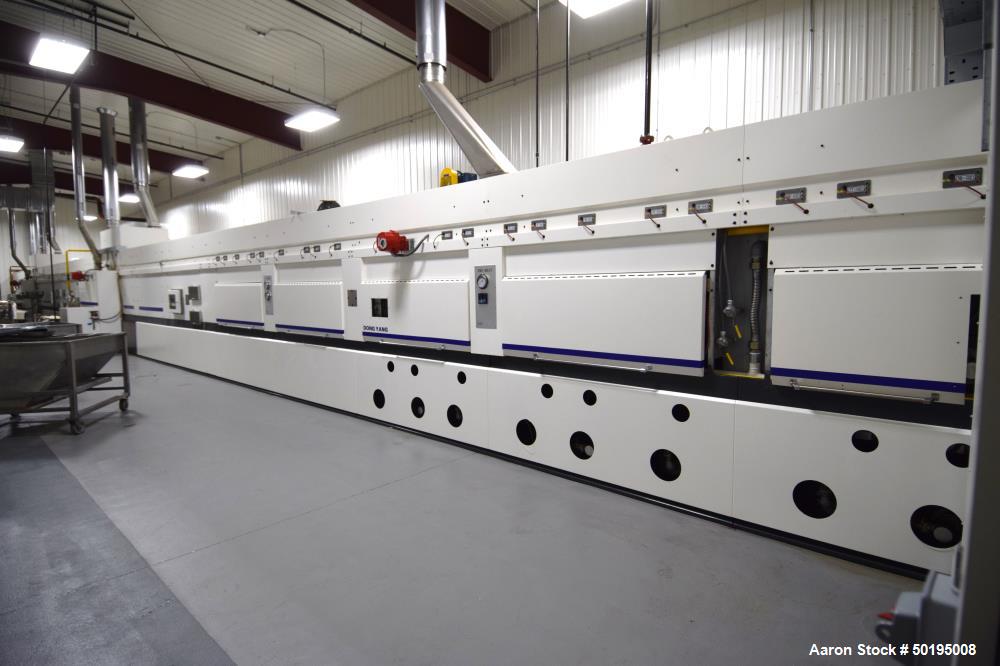 Used Dong Yang Food Machinery LPG Direct Cyclotherm Hybrid Oven. (3) Zones total, (1) direct heating section approximate 10.6m long, (2) indirect heating zones approximate 26m total. Baking length 37...