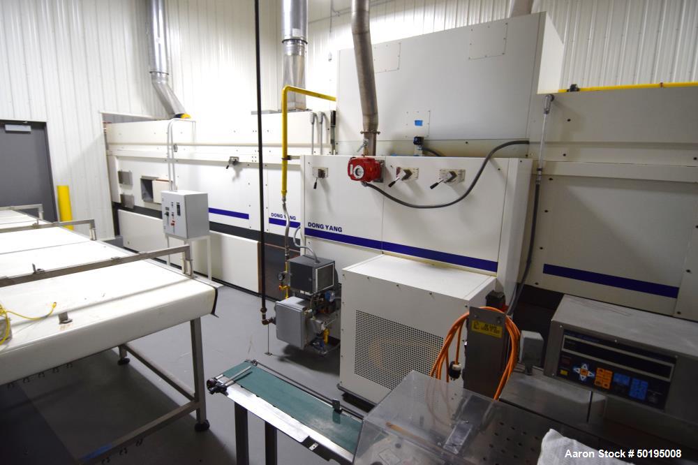Used Dong Yang Food Machinery LPG Direct Cyclotherm Hybrid Oven. (3) Zones total, (1) direct heating section approximate 10.6m long, (2) indirect heating zones approximate 26m total. Baking length 37...