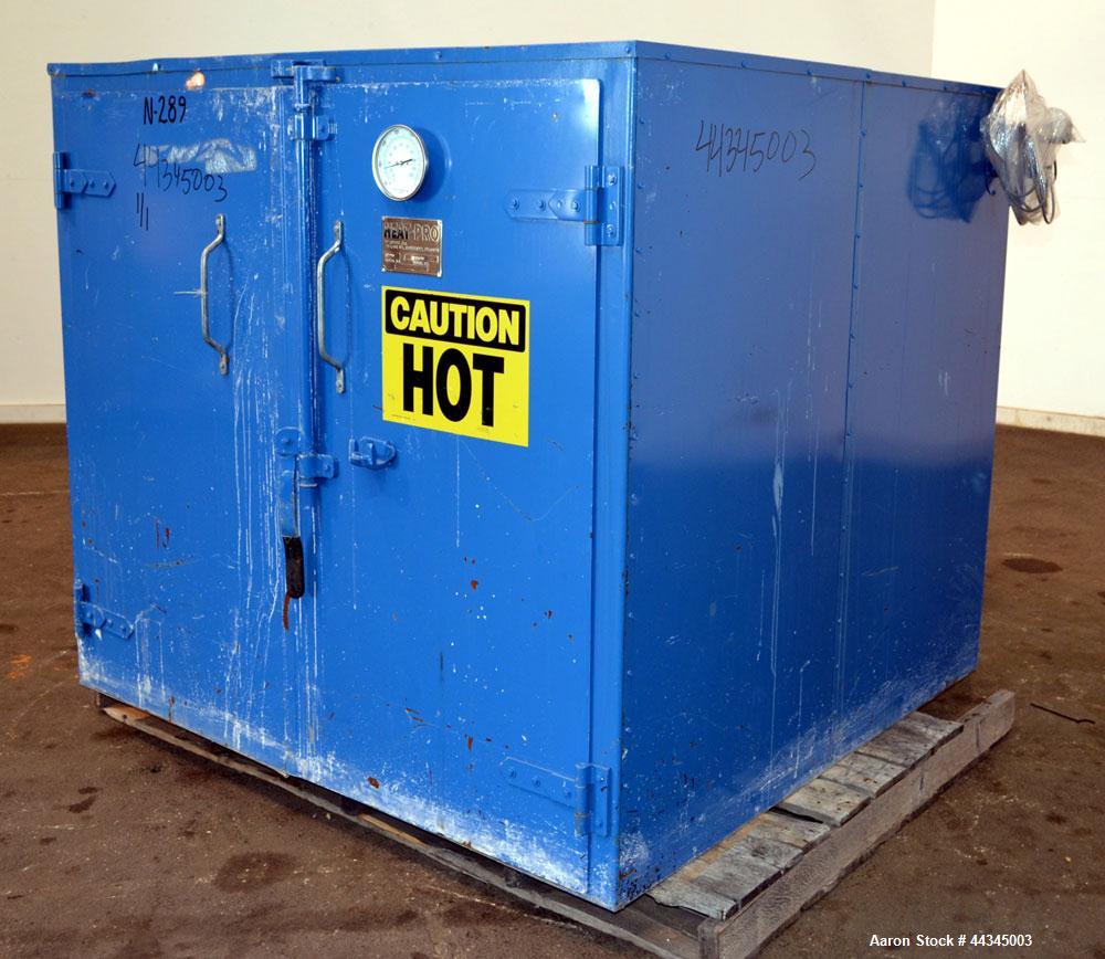 Used Heat-Pro Low Profile Drum Heating Oven, Model HPSCL4-C3, Carbon Steel. Heating medium saturated steam up to 200 psig, 34 square feet heating surface area, capacity (4) 55 gallon drums. Chamber a...