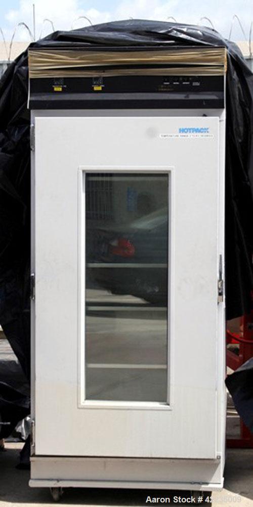 Used Hotpack Oven, Model 417532-S-212. Rated 0 to 70 deg C. Serial 82949, 230/60/1, chamber is 64" tall, 36" wide x 26" deep, 19 tray slots spaced 3", 4 trays 26" x 33"