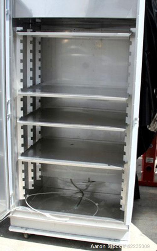 Used Hotpack Oven, Model 417532-S-212. Rated 0 to 70 deg C. Serial 82949, 230/60/1, chamber is 64" tall, 36" wide x 26" deep, 19 tray slots spaced 3", 4 trays 26" x 33"