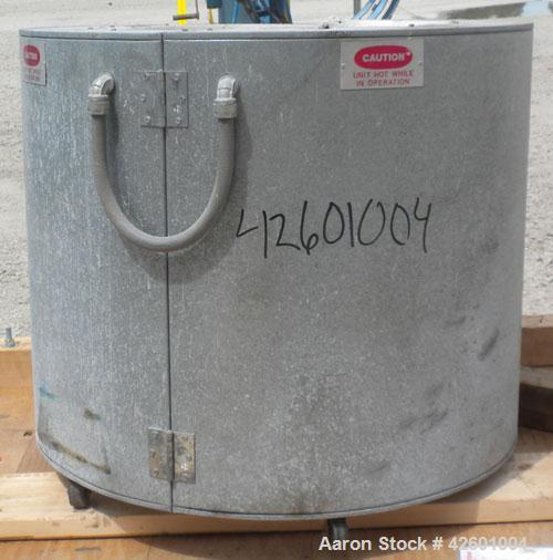 Used Ohmtemp 55 Gallon Drum Heater, model SWL-55-2301, carbon steel. Wrap-around design. Approximate 24" diameter x 30" deep compartment. 4.4 kW, 1/60/20 amp. Heaters and controls 230 volt. Manually ...