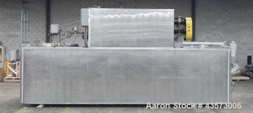 Used Babbco Indirect Gas Fired Tunnel Oven. C.H. Babb Co Inc oven has a 48"W metal ban coinveyor chain. Chamber measures 20'L Overall size is . 240"L x120"W x90"T. Last running pans of pizza crust. O...