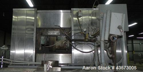 Used Babbco Indirect Gas Fired Tunnel Oven. C.H. Babb Co Inc oven has a 48"W metal ban coinveyor chain. Chamber measures 20'L Overall size is . 240"L x120"W x90"T. Last running pans of pizza crust. O...