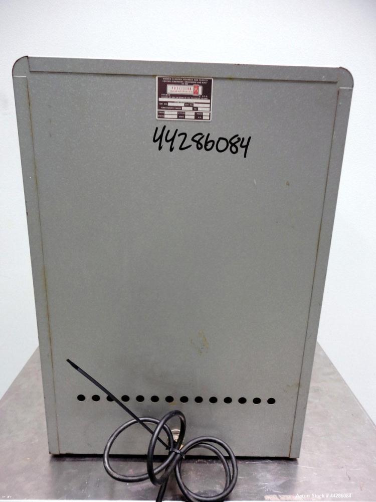 Used Precision Scientific Thelco Oven, Model 26. Temperature range to 200 degrees C. (392 F). Interior approximate 13" wide x 13" tall x 13" deep. Hinged front door. 1/50/60/120 volt, 8 amp, 950 watt...