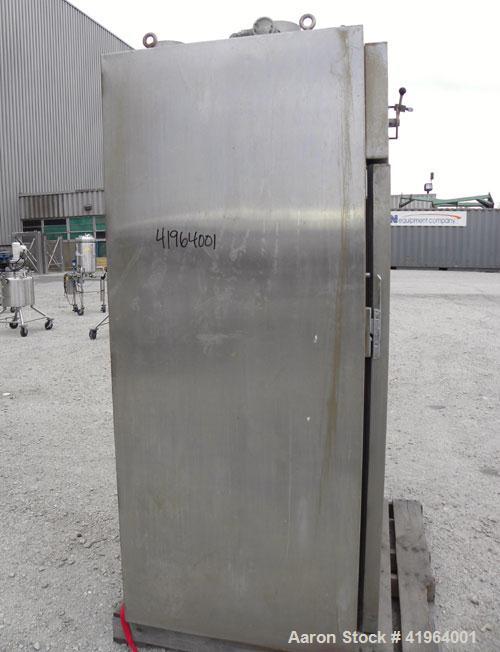 Used Stokes Drying Cabinet, Model 38-7, 304 stainless steel. Opening 40 wide x 63 tall x 30 deep. Includes a stainless steel roll out cart with (24) aluminum trays, 35 wide x 27 deep, spaced 1 apart....