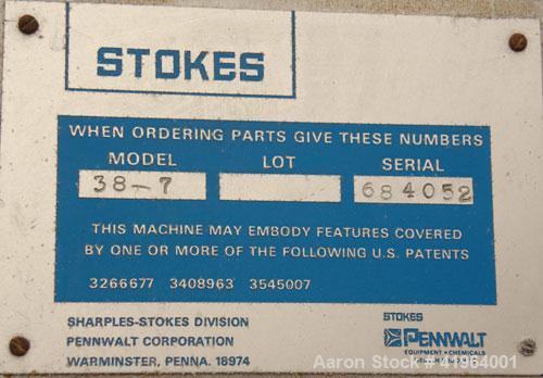 Used Stokes Drying Cabinet, Model 38-7, 304 stainless steel. Opening 40 wide x 63 tall x 30 deep. Includes a stainless steel roll out cart with (24) aluminum trays, 35 wide x 27 deep, spaced 1 apart....