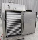 Used Stokes Drying Cabinet, Model 38-7, 304 stainless steel. Opening 40 wide x 63 tall x 30 deep. Includes a stainless steel roll out cart with (24) aluminum trays, 35 wide x 27 deep, spaced 1 apart....