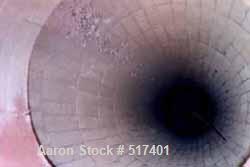 USED: Indirect Heating Kiln, overall approximately 8' high x 6' wide x 40' long. Attached to it is a combustion unit 13' long X 3' diameter. Kiln has stainless steel flexible conveyor running full le...