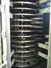 Used- Wyssmont Turbo Dryer, Model L-24.  Includes (24) 316 stainless steel rotating trays, 6' diameter, gas fired unit with ...