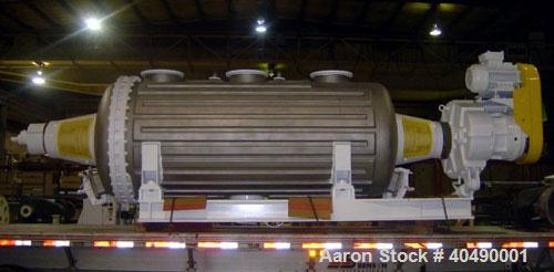 Used Buss rotary vacuum dryer, type S6300. Material of construction is 316 stainless steel on product contact parts. 304 stainless flat channel jacket. 293 cu ft (8300 liter) total capacity, 211 cu f...