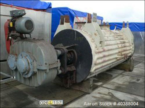 Used Buss Rotary Vacuum Dryer, type SF6300. Material of construction is 316 stainless steel on product contact parts. Stainless half pipe coil channel jacket. 211 cubic feet (6300 liter) working capa...