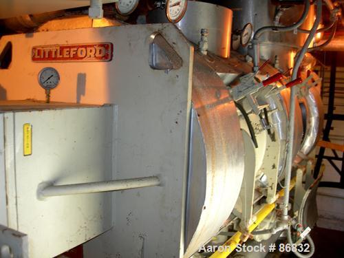 USED: Littleford plow mixer/dryer, model FKM1200D, stainless steel. 26 cubic feet working capacity, 43.4 total. Jacketed chamber approximately 32" diameter x 96" long. Internal rated FV at 320 deg F,...