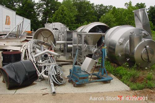Used Niro spray tower/spray dryer. 23' diameter x 41' tall, 304 stainless steel construction. Main chamber is double walled and insulated. Unit has a fluid bed unit with three steam coil heater units...