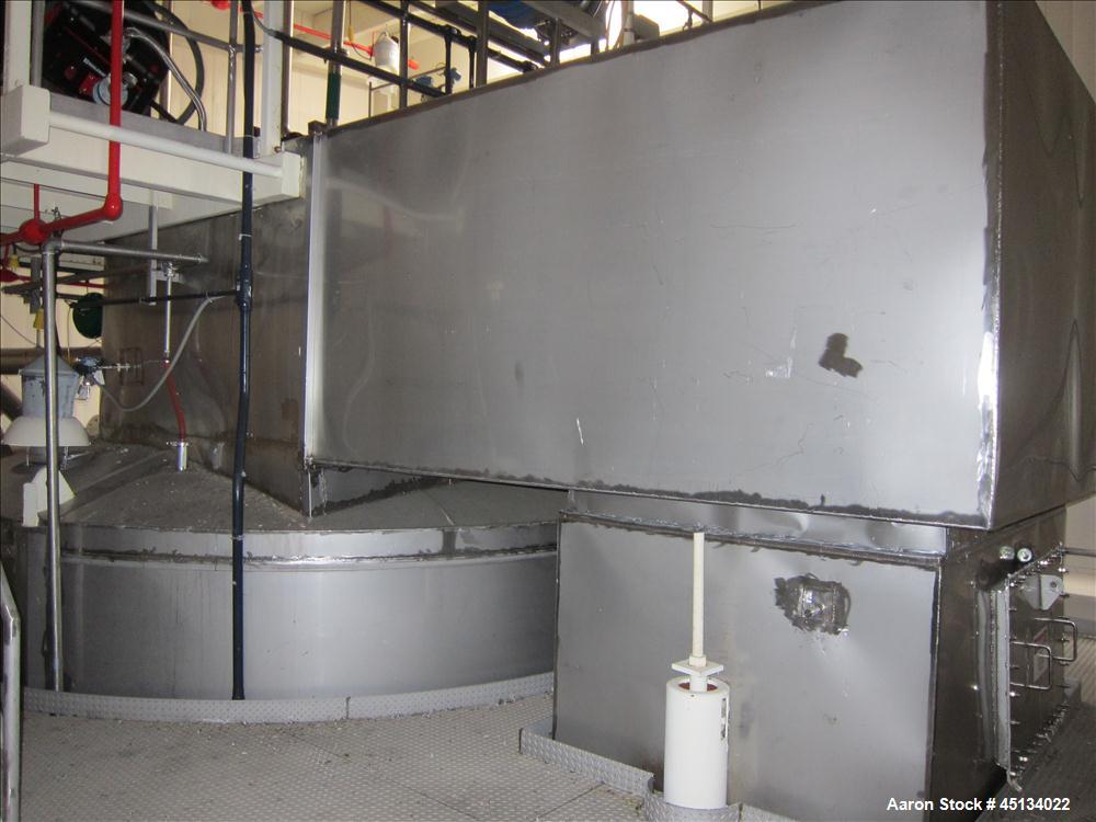 Used Niro Spray Tower Dryer. Originally designed for 12,500 pounds / hour of water evaporation. The dryer capacity was increased to 15,000 pounds / hour at 65,000 SCFM of air flow.  The Dryer is constructed of 316 L Stainless Steel. The dryer is a Standard Tall Form Dryer equipped with an integral static Fluid Bed Dryer and external Vibratory Fluid Bed Cooler. Both beds have heaters and the VFB also had a Cooler. The Dryer was equipped with fines return and agglomeration capabilities as an opti
